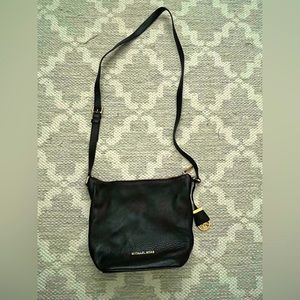 Michael Kors, black leather crossbody purse.